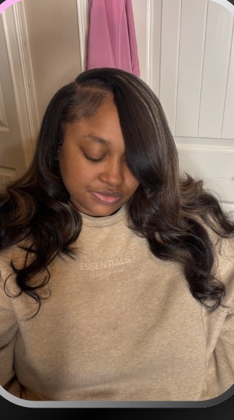Client with side-part body-wave install by Brasen's Luxury Boutique.