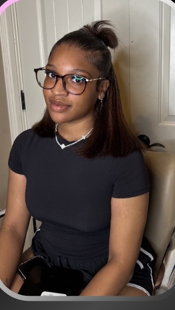 Client with sleek half-up style by Brasen's Luxury Boutique.